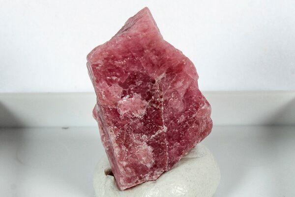 A Rhodonite crystal from the Morro da Mina Mine in Brazil.